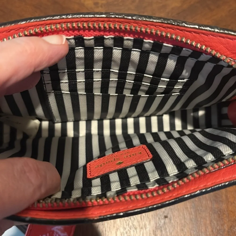 Kate Spade wristlet  pebble leather/patent bow on front  orangeish red gold NWOT